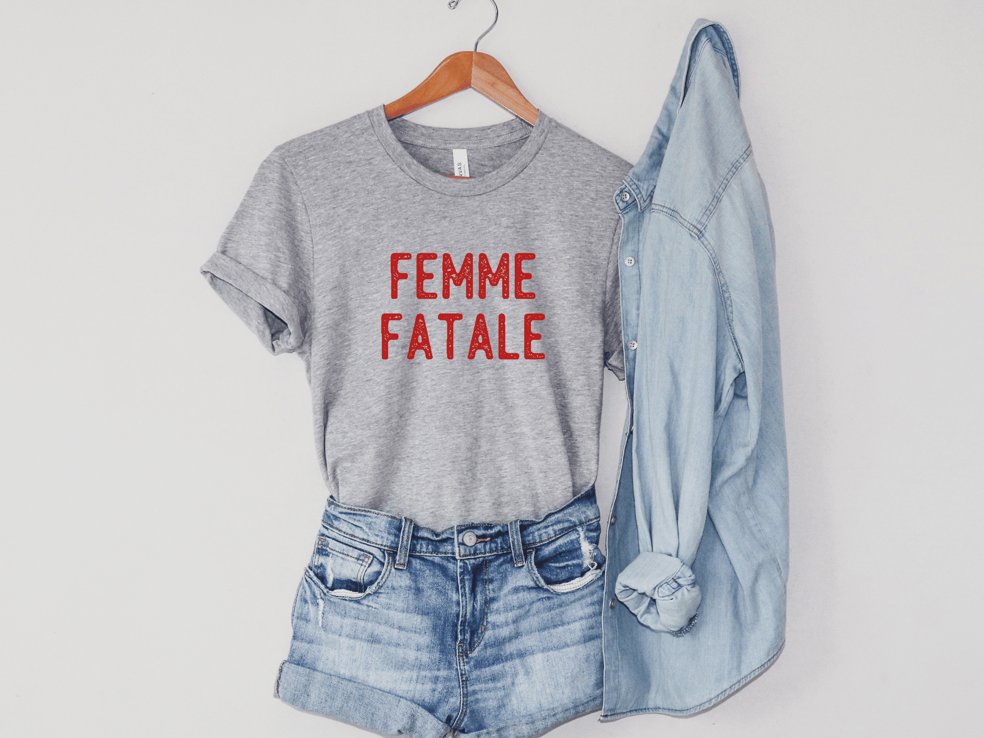 Femme Fatale T-Shirt in Athletic Gray on a Hanger.