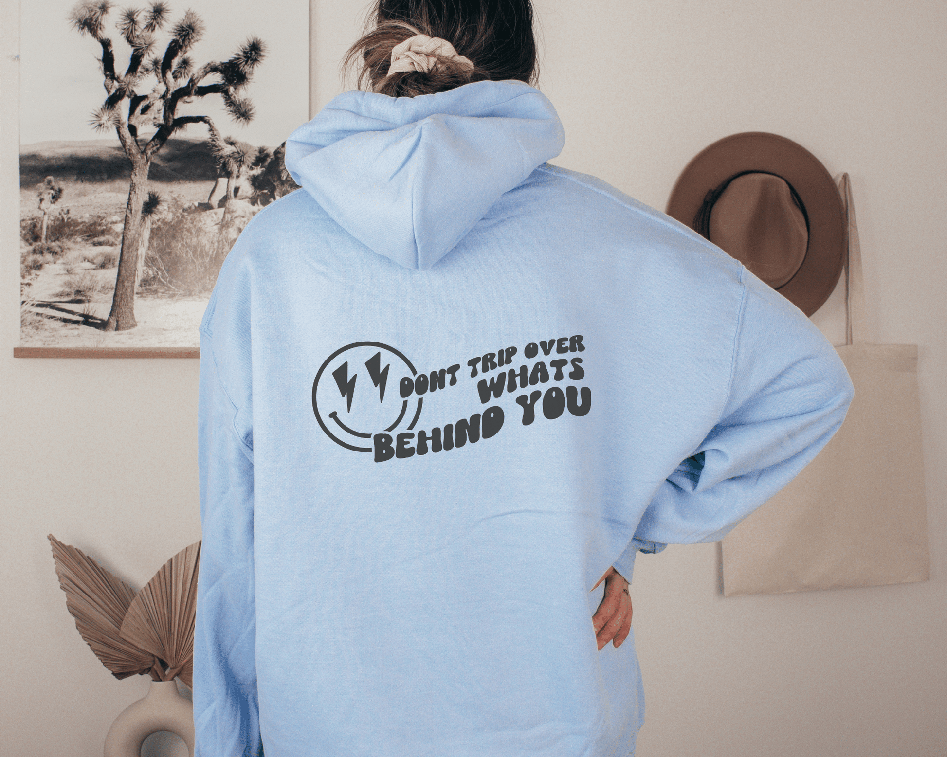 Don't Trip Over What's Behind You Hoodie in Light Blue, back of hoodie.