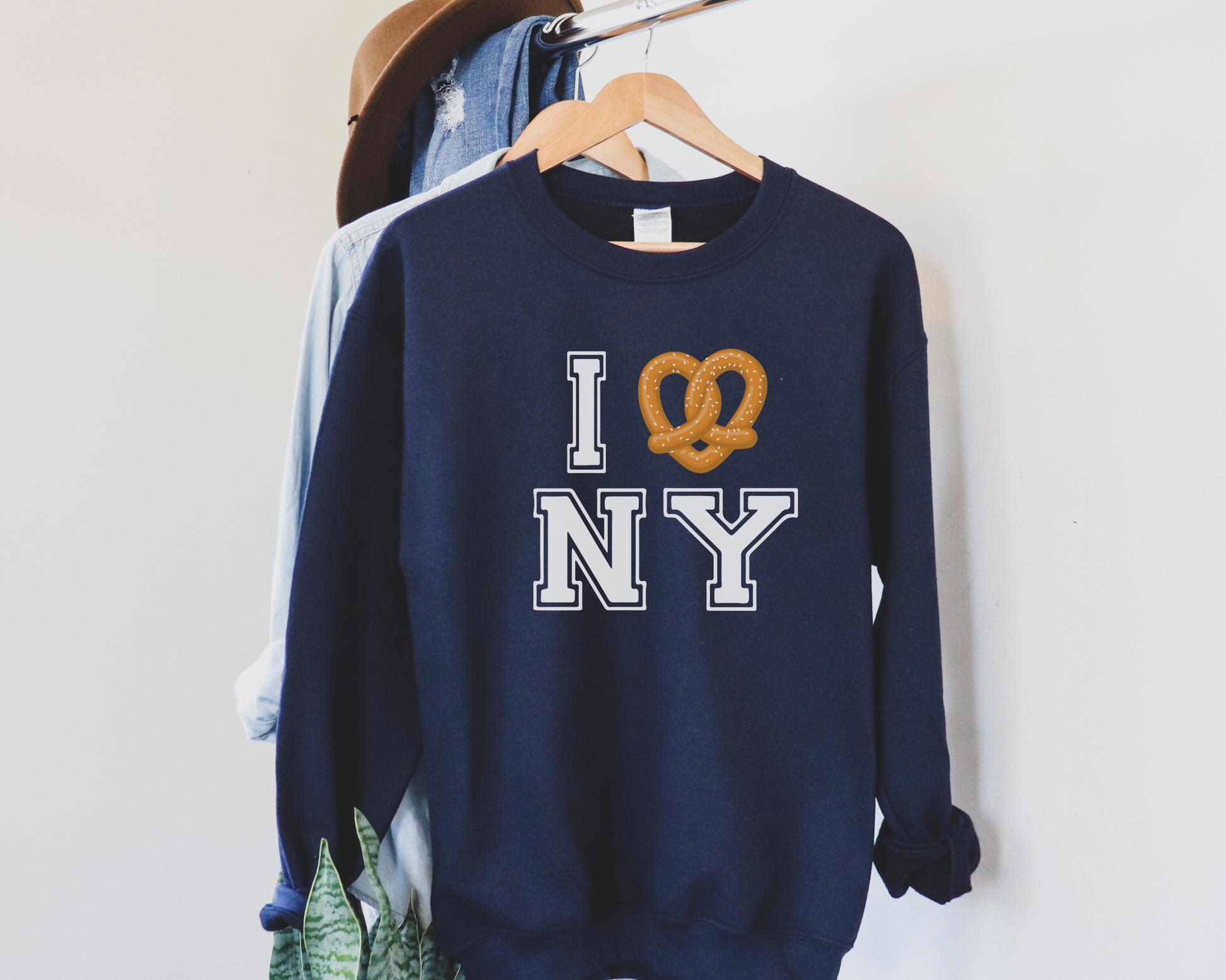 I Pretzel (Love) New York Sweatshirt in Navy, hanging.