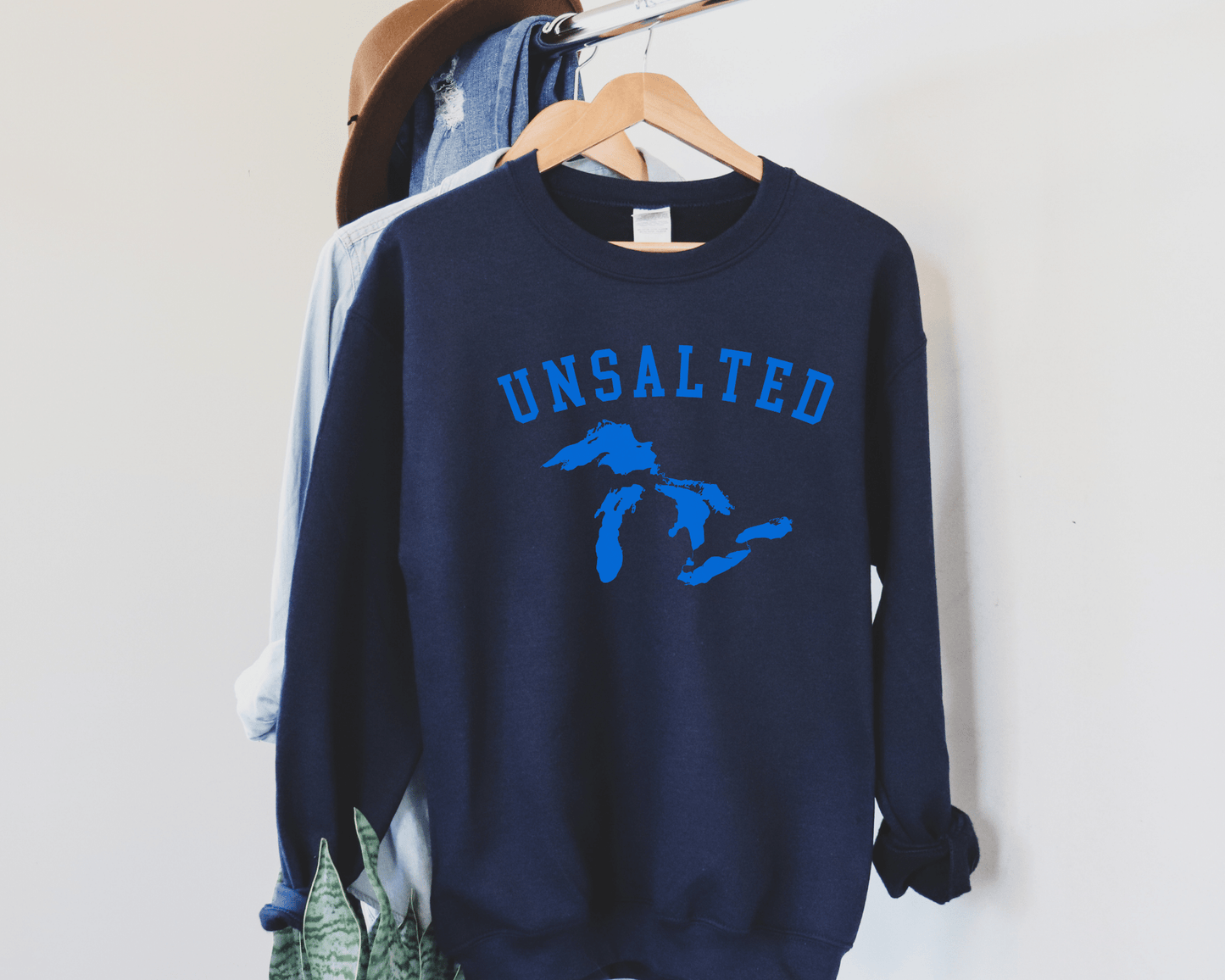 Unsalted Great Lakes Sweatshirt in Navy, hanging.