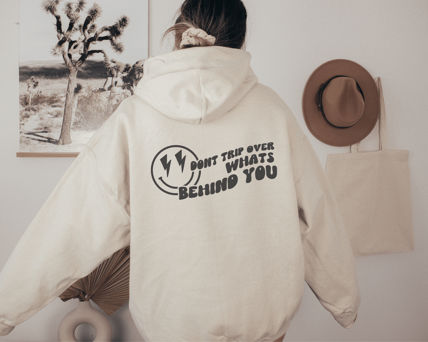 Don't Trip Over What's Behind You Hoodie in Sand, back of hoodie.